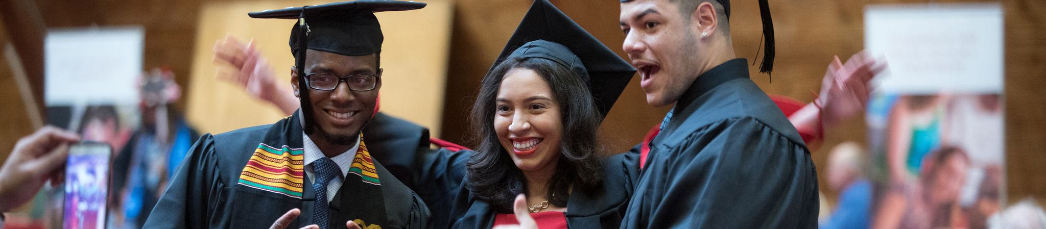 Graduation ceremony. Excited student receiving their diploma.